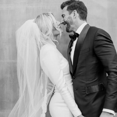 Charissa thompson with her husband in their wedding